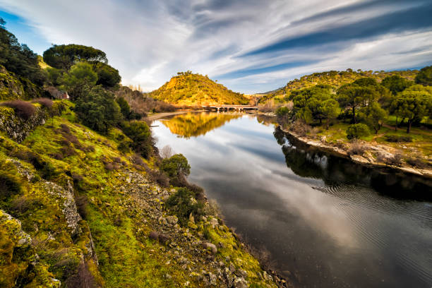 istock Bridge over the Picadas reservoir and reflections in the river Alberche 2194843505