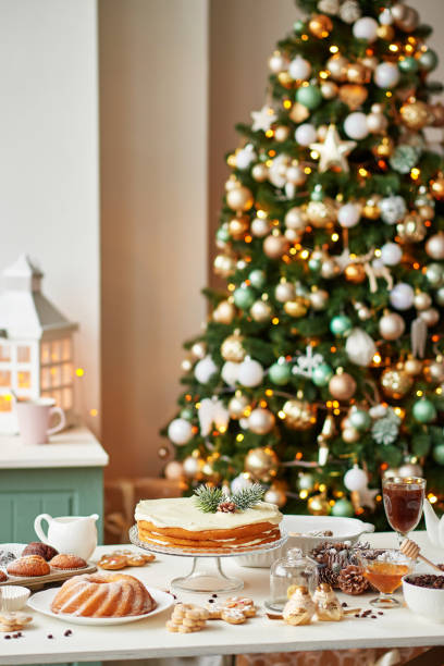 istock Christmas cake and sweets on table. Christmas decorations with lights background. Happy New Year! Christmas greeting card. Winter card template. Xmas concept. Holiday Banner. Feast of Nativity. 2194843581