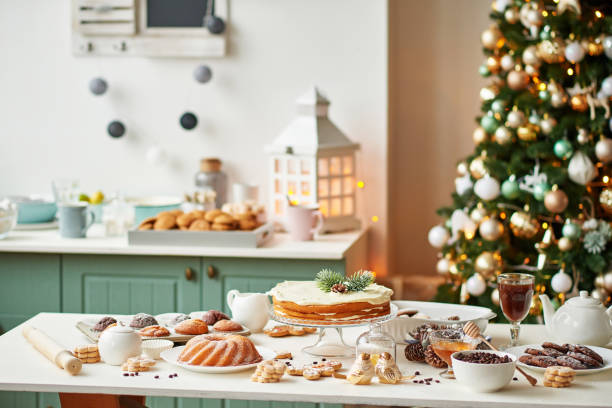 istock Christmas cake and sweets on table. Christmas decorations with lights background. Happy New Year! Christmas greeting card. Winter card template. Xmas concept. Holiday Banner. Feast of Nativity. 2194843632