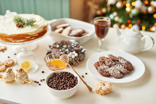 istock Christmas cake and sweets on table. Christmas decorations with lights background. Happy New Year! Christmas greeting card. Winter card template. Xmas concept. Holiday Banner. Feast of Nativity. 2194843668