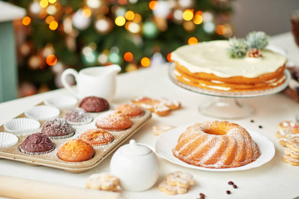 istock Christmas cake and sweets on table. Christmas decorations with lights background. Happy New Year! Christmas greeting card. Winter card template. Xmas concept. Holiday Banner. Feast of Nativity. 2194843717