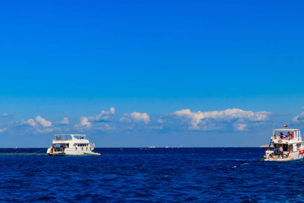 Hurghada, Egypt - December 7, 2018: White yachts sailing in the Red sea, Egypt