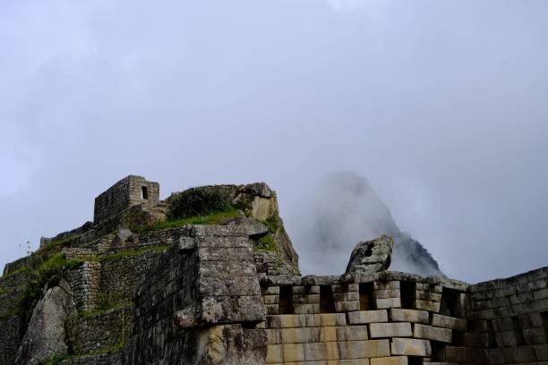 istock Machu Picchu stone ruins with misty mountains. 2194845818