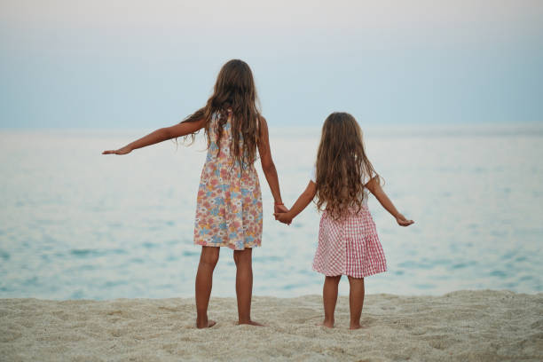 istock Beautiful sisters enjoying summer vacation 2194845835