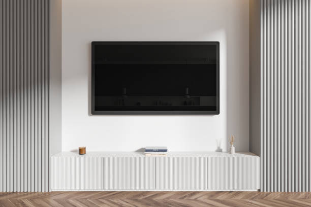 istock Modern living room interior with wall-mounted TV and white cabinet. 3D Rendering 2194846126