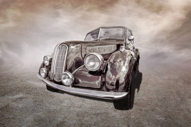 istock old car stands on sepia clouds background 2194847670