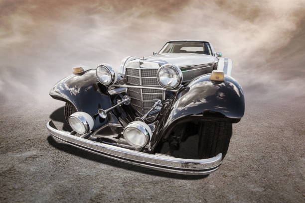 old car stands on sepia clouds background