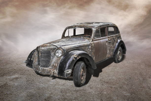 istock old car stands on sepia clouds background 2194847704