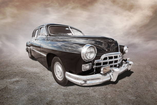 istock old car stands on sepia clouds background 2194847719