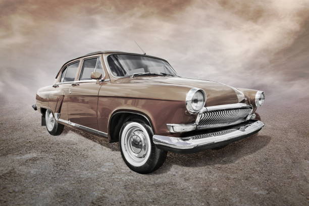 old car stands on sepia clouds background