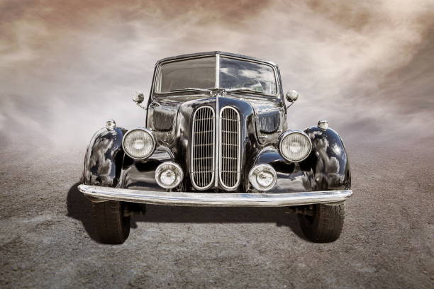 istock old car stands on sepia clouds background 2194848410