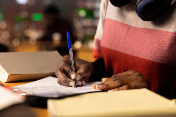 istock African american college student writes her bachelor degree paper 2194848758