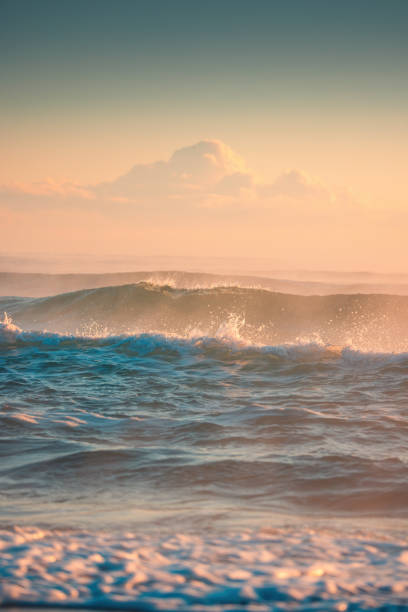 istock Beautiful Ocean Waves Captured During A Golden Sunset Over Serene Waters 2194849203