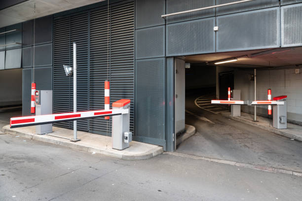 istock Modern parking garage entrance featuring automated barriers, security measures, and a streamlined urban infrastructure 2194850227