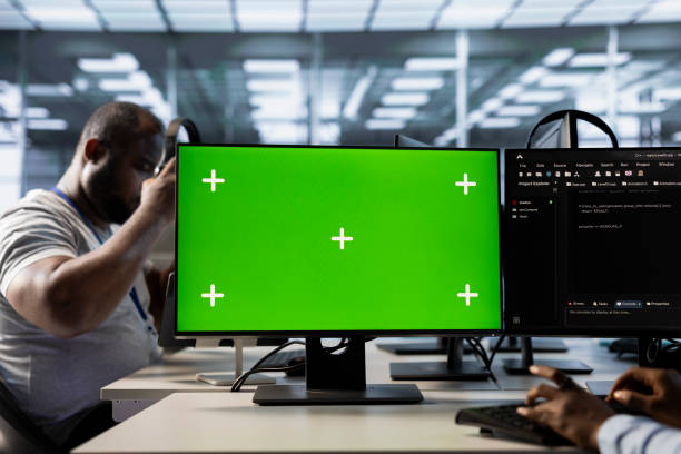 istock Server farm worker uses mockup computer display to monitor performance 2194850496