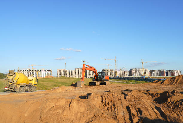 istock Excavator on groundwork on Construction site. Backhoe dig foundation for house construction. 2194853558
