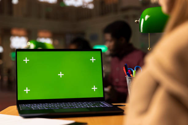 istock Young student working with a green screen in the university campus library 2194854085