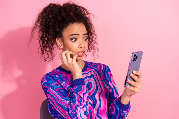 istock Photo of impressed shocked lady dressed retro sweatshirt getting dislikes modern device empty space isolated pink color background 2194854115