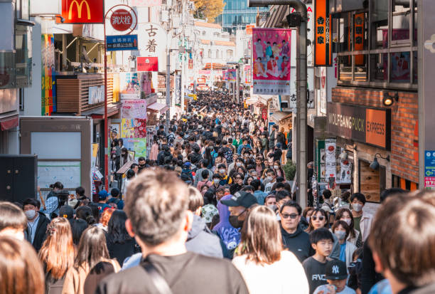 Tokyo, Japan - A street in Shibuya's Harajuku district crowded with pedestrians.