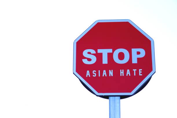 istock Stop asian hate concept. social issues. letters written on red stop sign. 2194855540