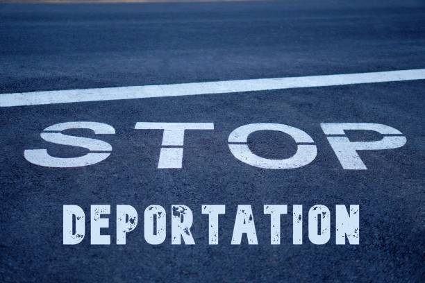 istock Stop deportation concept. social issues. letters written on road signs. 2194855541