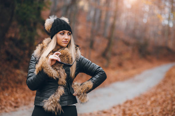 istock Smiling Woman in Autumn Outfit Enjoying a Stroll in Fall Setting 2194855910
