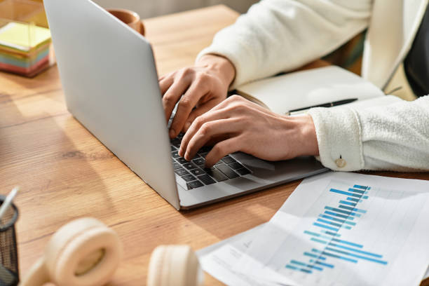 istock Young man working on laptop in modern apartment with cozy atmosphere 2194860462