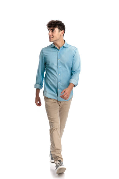 istock happy casual student in his 20s walking and looking to side 2194861480