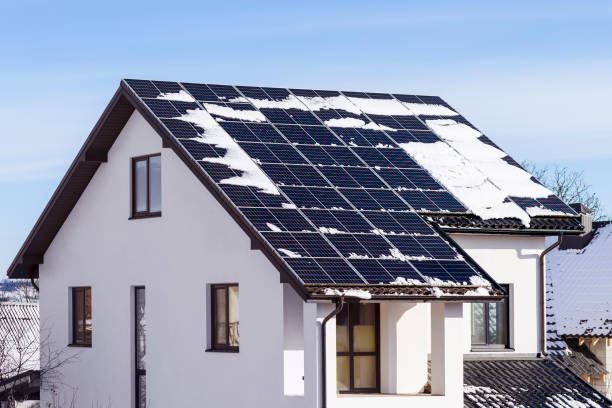 istock Winter Solar Panels on House Roof 2194861717