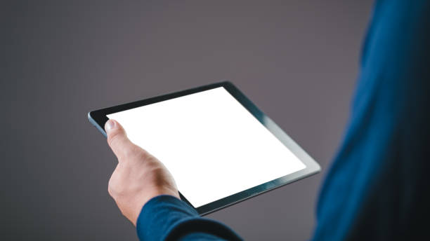 istock Person holding a digital tablet with a blank white screen, suitable for mockups, presentations, and digital content demonstrations. 2194863366
