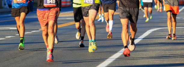 istock Runners Competing in a Marathon on a Sunny Day in an Urban Setting 2194863649