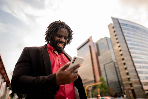 istock Businessman using mobile phone in the city 2194866432