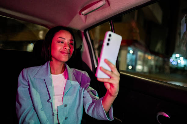 istock Businesswoman using mobile phone inside the car 2194867028