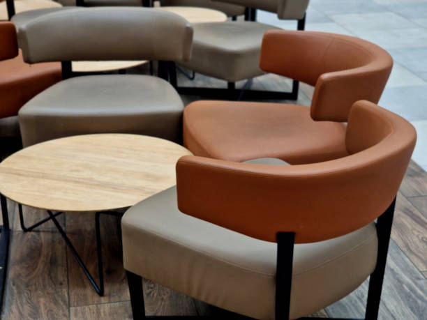 istock circle-shaped tables in the cafe with leather upholstery. brown curved chair backs 2194867288