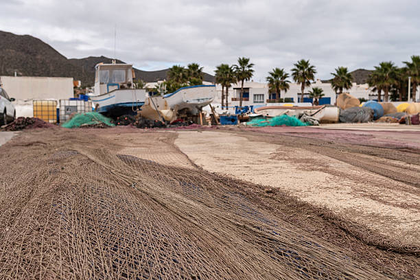 Small fishing boats and their nets. Defocused background