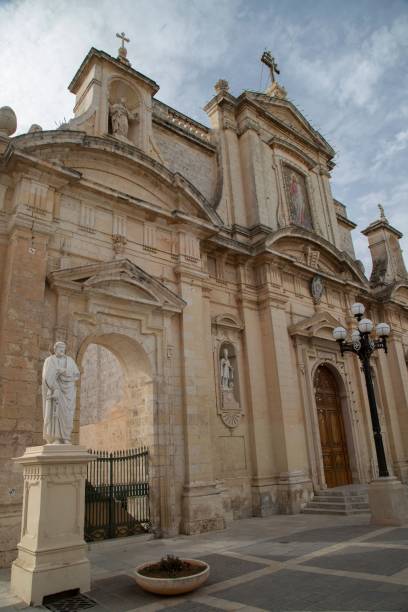 istock Historic church facade with statues and ornate architecture. 2194869138