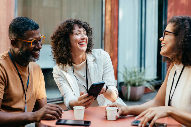 istock Coworkers from different backgrounds enjoying a cheerful coffee break together 2194870002