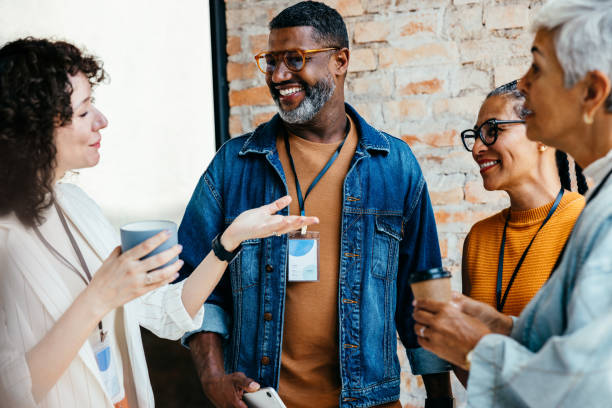 istock Friendly business colleagues enjoying a casual coffee break while engaging in positive conversation and networking 2194870731