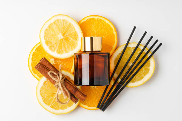istock Aromatic display of essential oils with citrus fruit and chopsticks on a minimalist background 2194872793