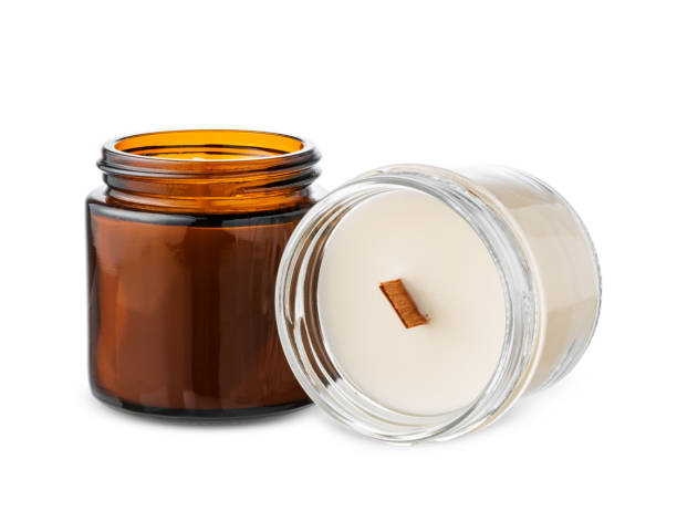 istock Glass jars filled with scented candles on a white background 2194873954