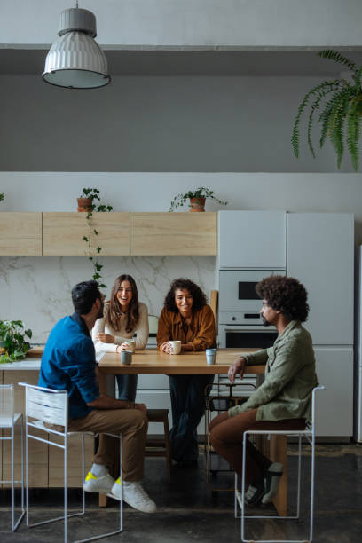 istock Young adults enjoying coffee break in modern kitchen 2194875799