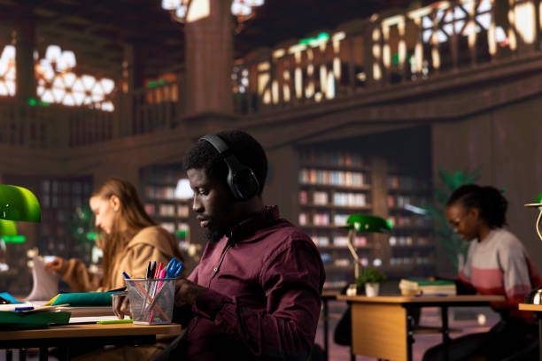 istock African american guy student uses ambient focus music to help work on assignment 2194878272