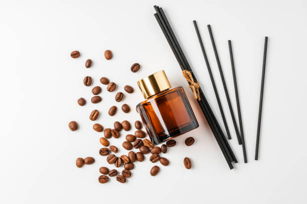 istock Scented oil diffuser with coffee beans and reeds arranged on a white background 2194878944