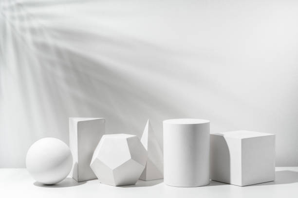 istock A collection of white geometric shapes arranged on a table in a bright studio setting 2194878945