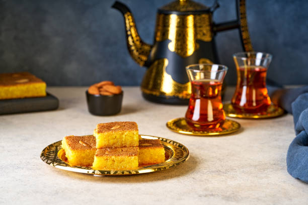 istock Middle eastern traditional semolina cake basbousa , namoora, hareesa served with tea 2194879207