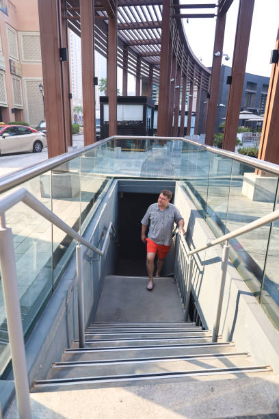 istock man in summer clothes climbs the steps from an underground passage 2194884645