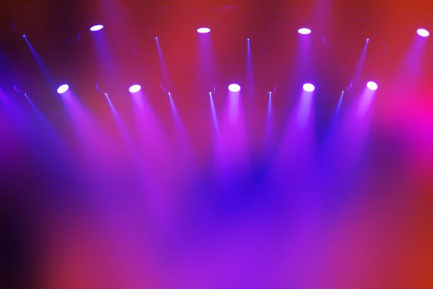 istock A rainbow of pink and blue light from the stage lights. 2194885883