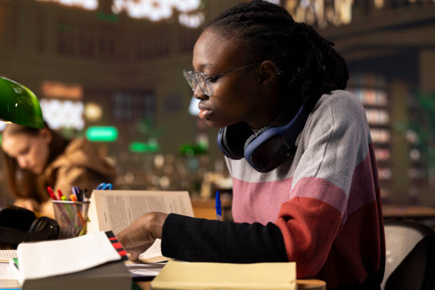istock African american college student writes her bachelor degree paper 2194887001