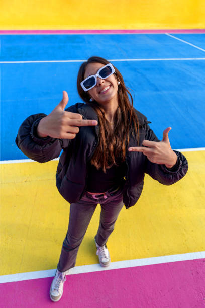 istock Young woman making hand gesture on colorful background 2194889110