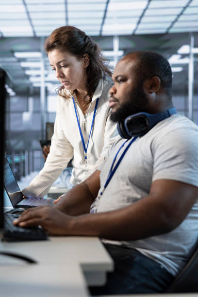 istock Teamworking colleagues updating AI systems on PC and laptop 2194889415